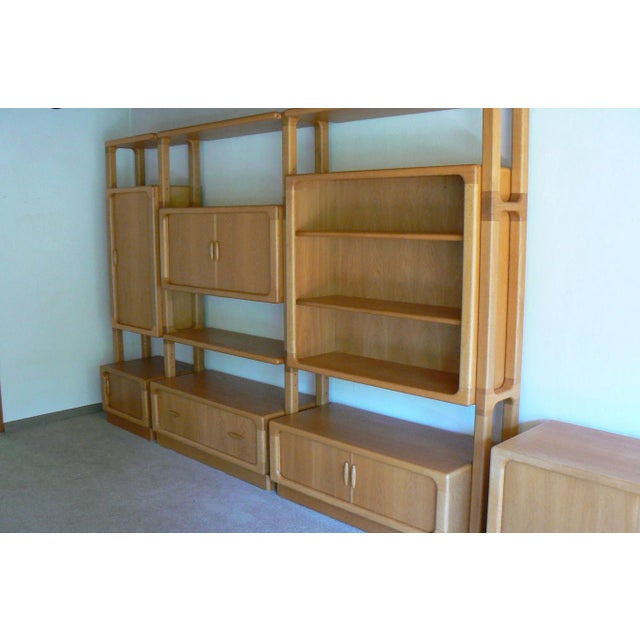 - Oak wall unit produced by Dyrlund in Denmark - Four compartments with sliding-doors - Open shelves - One big drawer -...