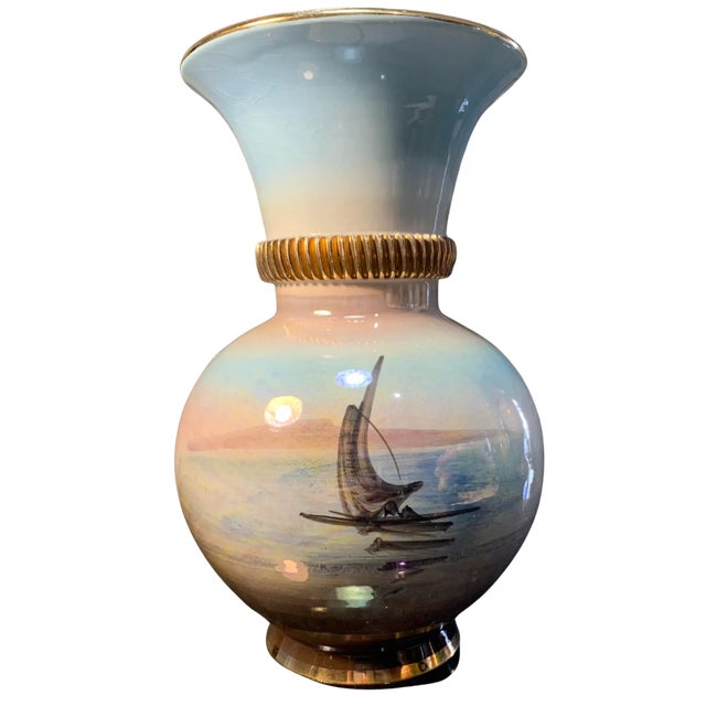 This exquisite 9-inch tall porcelain vase, hand-painted and masterfully crafted by Italian artisans, captures a dual...