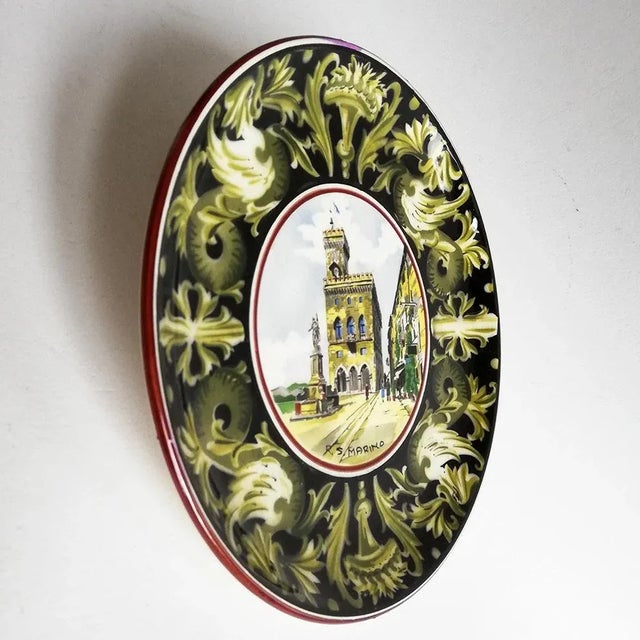 This centerpiece plate is decorated with a view of the city of San Marino. It was produced by the ceramic brand Titano. It...