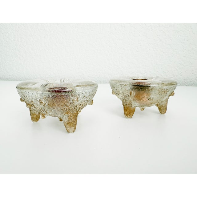 French Art Deco era early 1900s pair of art glass taper candle holders in the style of André Thuret. The well of the...