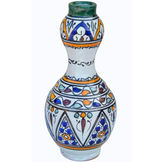 Spectacular antique Moroccan ceramic vase accent thoughtfully handcrafted and glazed exhibiting an elaborate hand-painted...