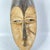 The Fang face mask, displaying wear both on its surface and interior, signifies its age and extensive use.Â It is crafted...