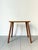 A simple 20th century cotswold school wooden side table or coffee table with chamfered leg detail, in a useful and...