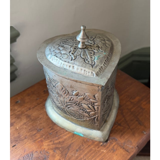 Sweet, hand made heart-shaped tin box. Hand tooled with leaf/botanical motif. Wonderful patina. This would be such a fun...