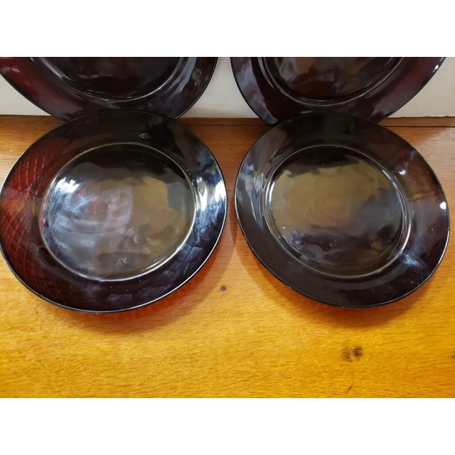 This is a Set of 4 Ruby Red Cristal d'Arques Durand Dinner Plates. Each measures 1" high and 10 1/8“ in diameter. The...