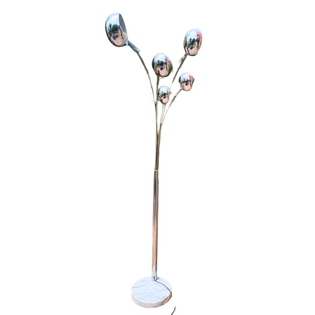 A spectacular vintage Italian floor lamp inspired by the futuristic elegance of the Space Age era. Rising gracefully on...