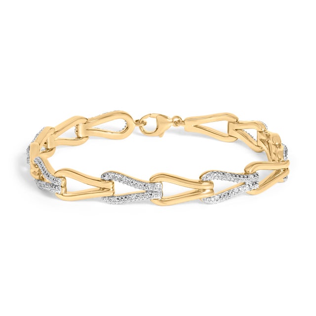 A luminous ode to connection, this bracelet traces the wrist with a repeating open knot motif—an airy silhouette that...