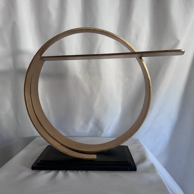 This sculpture ives the phrase "band of gold" to a whole new meaning. Traditionally, rings symbolize eternity, and in this...