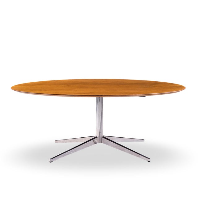 Florence Knoll Mid Century Walnut and Chrome Oval Dining Table This dining table measures: 78 wide x 48 deep x 28 inches...