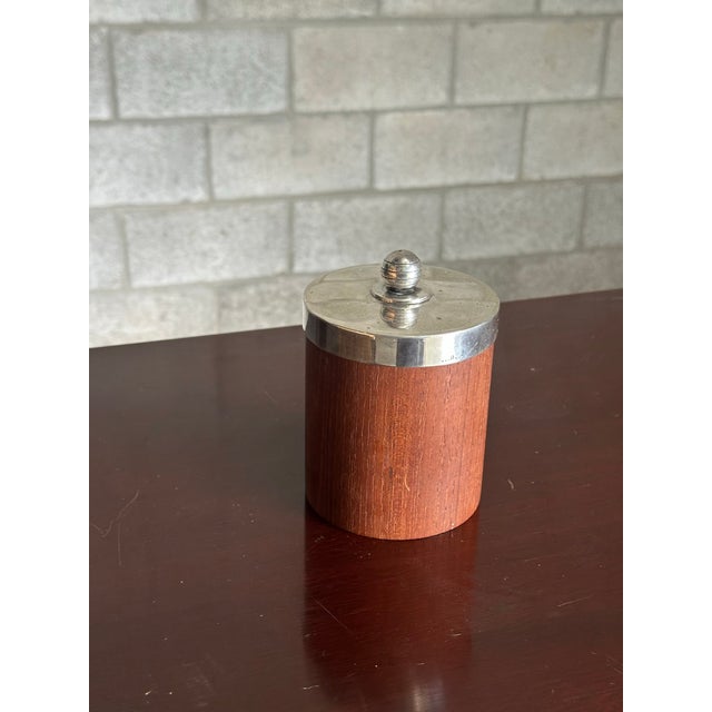 A wonderful teak jar with silver lid produced by GAB of Sweden (Guldsmedsaktiebolaget). Nice simply design with subtle...