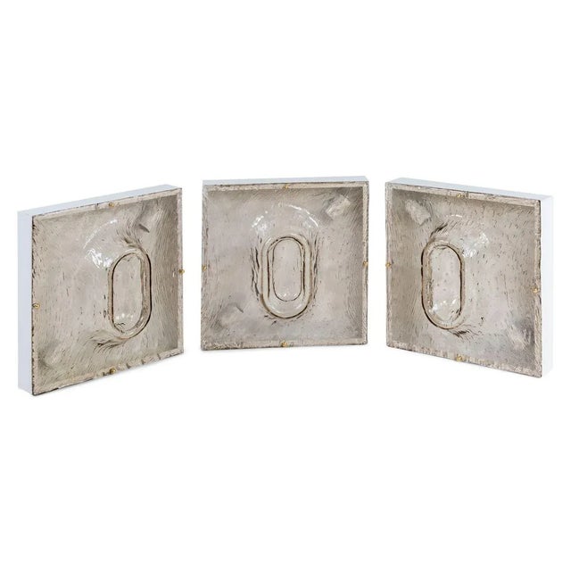 8 Toni Zuccheri sconces for Venini. Made in Murano and structured smoked glass with central oval increase in white metal...