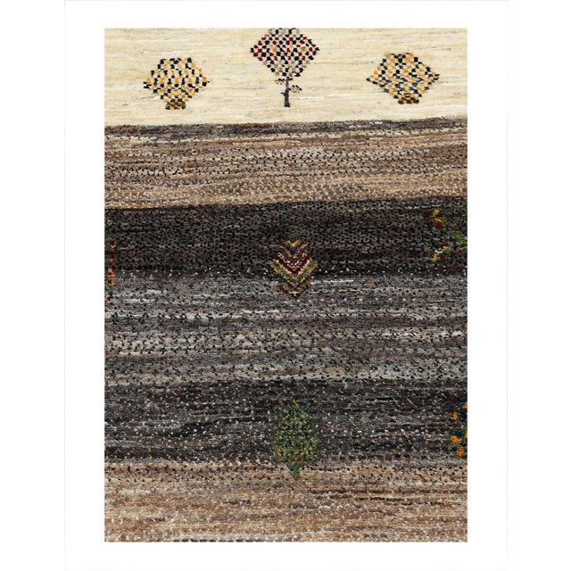 Gabbeh rugs are made by the nomadic Qashqai tribes of southern Iran. They are rough cut and long piled rugs of rich color...