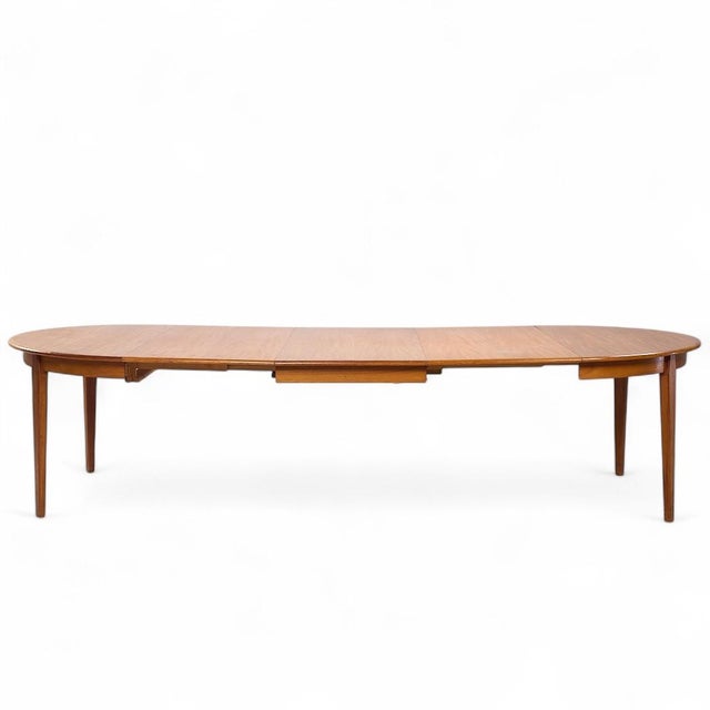 Arne Vodder Mid Century Danish Teak Expanding Round Dining Table with 3 Leaves This table measures: 48 wide x 48 deep x 29...