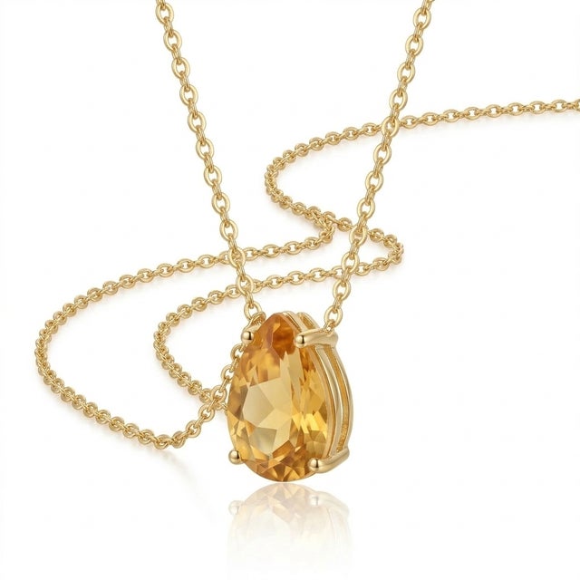 Citrine Pear-Shaped Pendant Necklace This elegant necklace features a radiant citrine gemstone, admired for its warm...