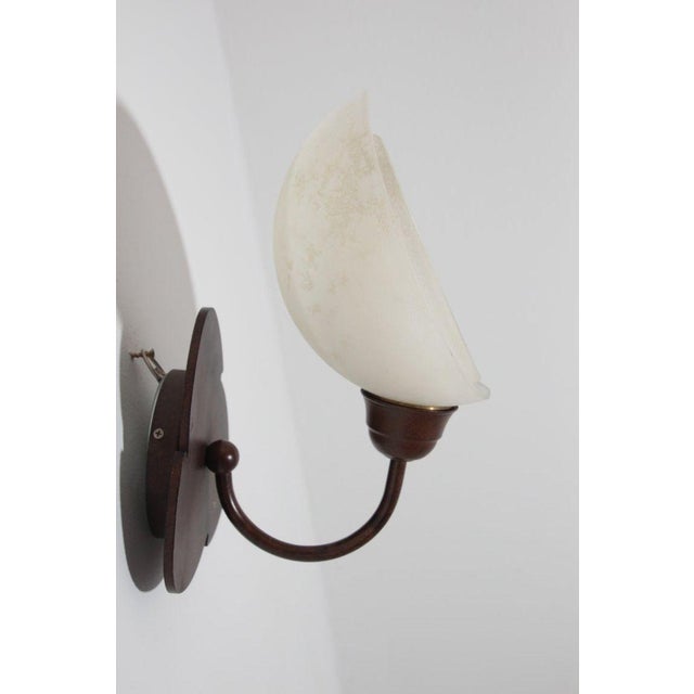 Italian Murano frosted glass and bronze finish metal wall sconce produced by Relco Milano, 1980s. Unusual 1980's bronze...
