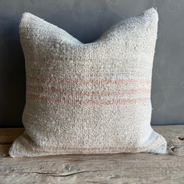 Creamy white hemp rug pillow with stripes. Soft hand, linen blend backing with zipper closure. Spot cleaning is...