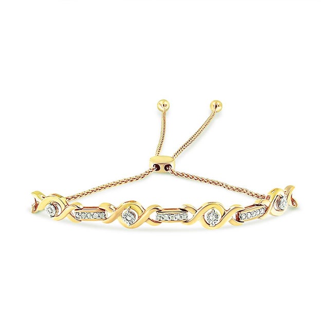 Certain to create a sophisticated look with any attire, this stylish diamond bolo bracelet is composed of 14k yellow gold...