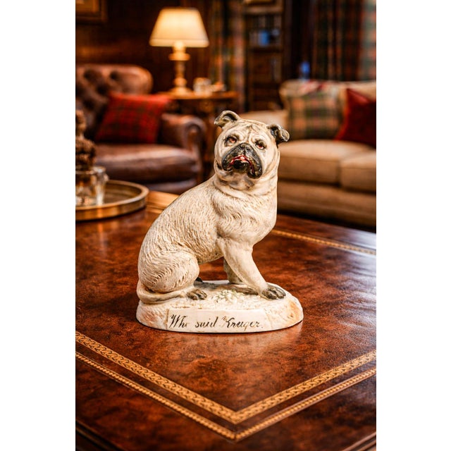 This captivating antique bisque porcelain pug dog figurine is a finely hand-painted example of late Victorian satire,...