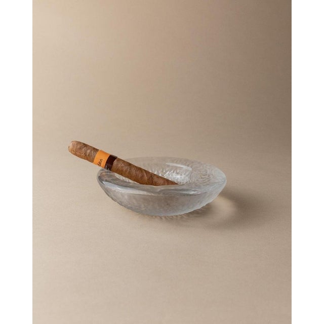 This vintage Murano glass ashtray, designed in Italy in the 1970s, is a beautiful example of clear and iced glass with a...