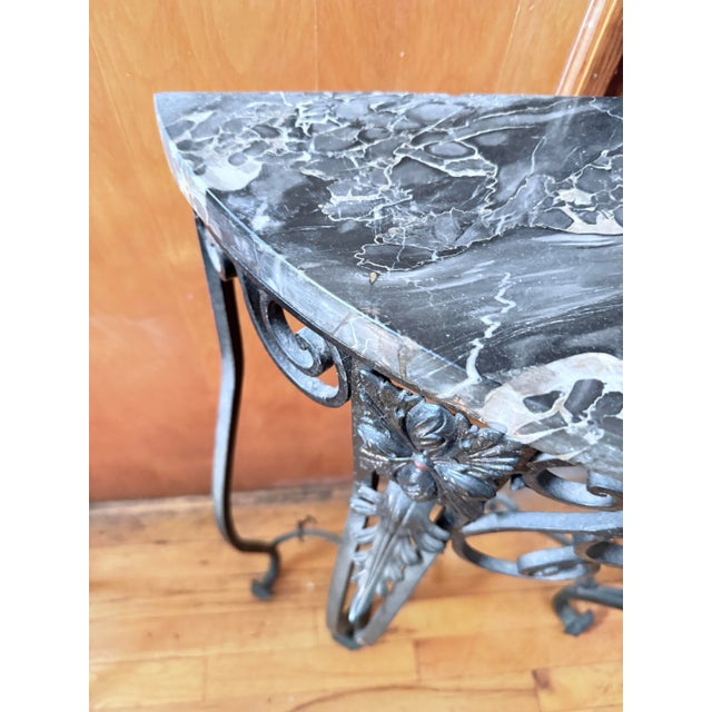Antique French demilune console table in the Art Deco / Belle Époque style, dating to the late 19th century through the...