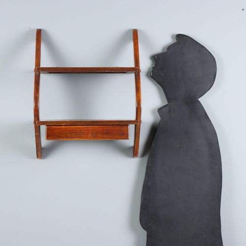 Wall-mounted shelves, one with an under-counter drawer. Made of mahogany and walnut veneer. In good condition. This piece...