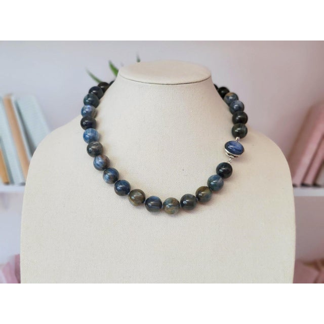Exquisite Natural Blue Kyanite & Sterling Silver Necklace Description: This timeless necklace harmoniously blends the...