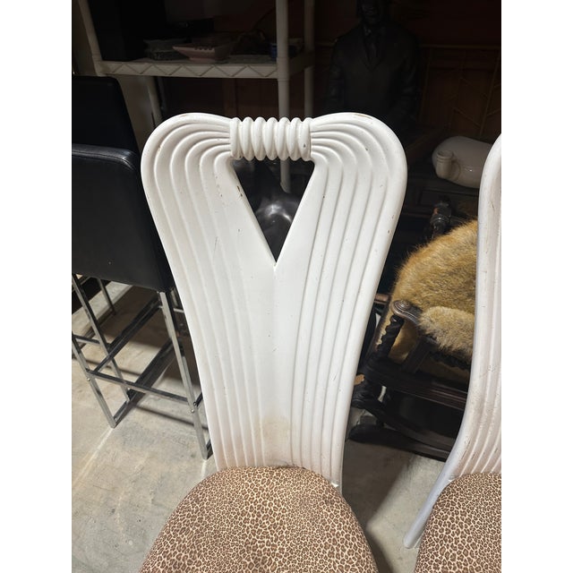 Up for consideration is a beautiful vintage collection of post modern art deco ribbon chairs with leopard print cushions....