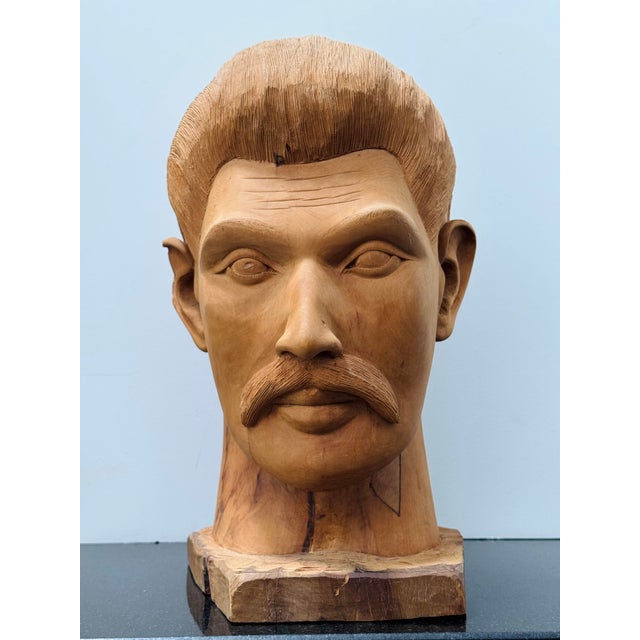 This 1960s folk art carving of a mustachioed man with a pompadour was used as a counter top display in a Detroit barber...