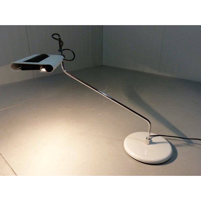 Large halogen desk lamp, Italy. White steel foot, white steel shade with on top a black perforated steel top, chrome arm....