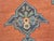 Vintage Anatolian hand-knotted wool rug featuring a bold geometric medallion on a warm terracotta field, framed by an...