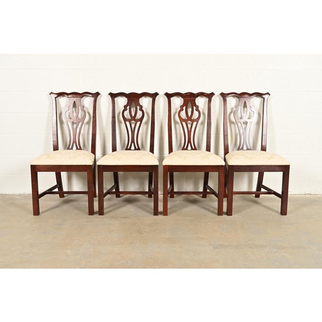 A gorgeous set of four Georgian or Chippendale style dining chairs By Thomasville USA, Late 20th Century Carved mahogany...
