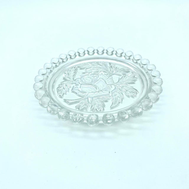 Cute trinket dish with embossed roses and a candlewick rim. Perfect to put trinkets, rings, jewelry, or soap.