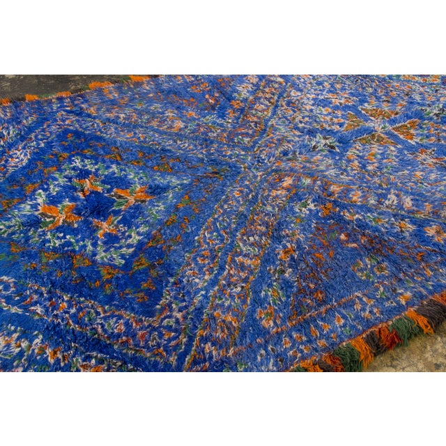 Hand-knotted in wool and originating circa 1950-1959, this 7x11 vintage Moroccan berber rug joins Rug & Kilim’s Moroccan...