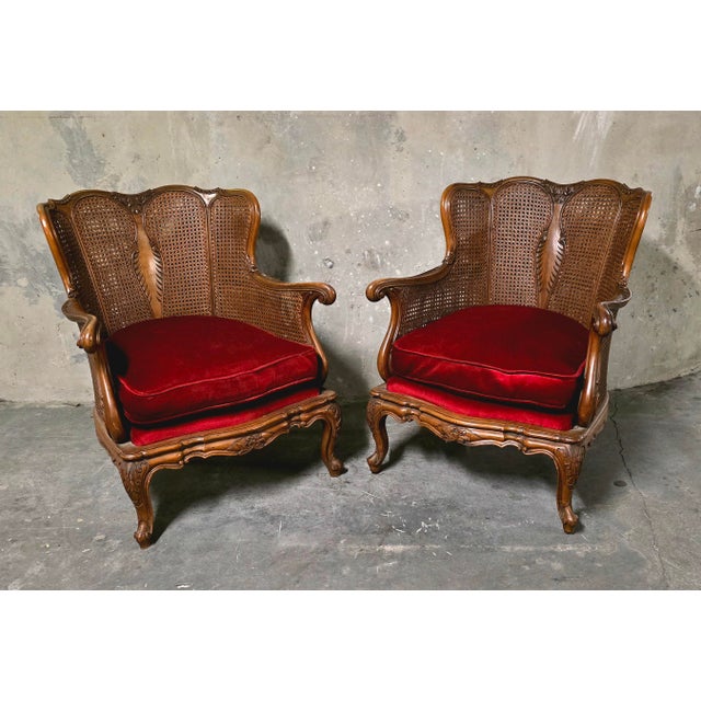 Pair of louis xv style carved wooden armchairs, resting on cabriole legs with molded decoration. Backs and armrests are...