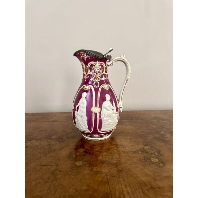 Quality antique Victorian pewter lidded water jug, having a quality antique Victorian water jug decorated with classical...