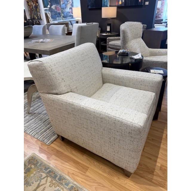 Neutral accent chair, ready to be added into any space. Squared body, and tight T-Back mixes makes for a Mid-Century...