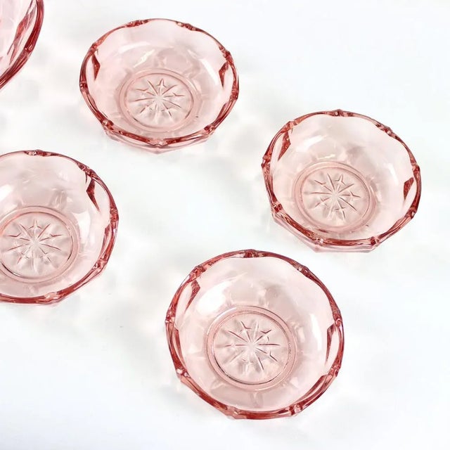 Beautiful set of five bowls produced in pressed glass in a lovely rose colored glass. The set can be used in the house, or...