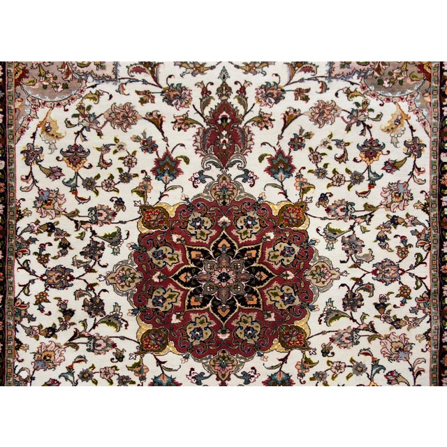 An incredible late 20th century Persian Tabriz hand-knotted silk and wool rug with a large central floral medallion living...