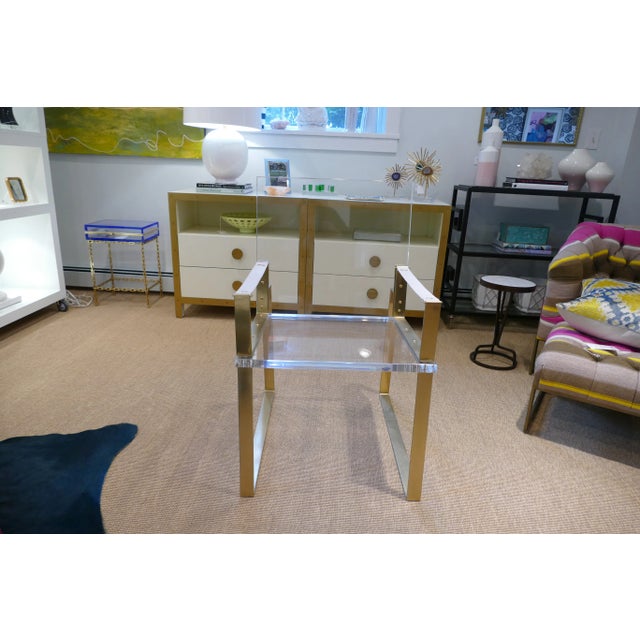 This is a super high grade polished acrylic chair with a steel frame finished in bronze with bronze bolts. The pebbled...