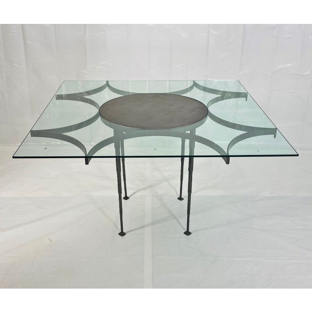 This striking vintage dining table is executed in the Brutalist style, showcasing a bold architectural presence defined by...