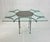 This striking vintage dining table is executed in the Brutalist style, showcasing a bold architectural presence defined by...