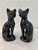 Mid-Century pair of ceramic sitting black Siamese cat figurines in a high gloss finish.