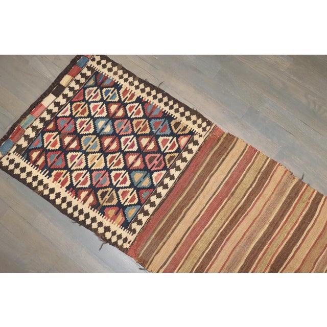 A tribal caucasian Bagface kilim from the 19th century. Measures: 20'' x 91''