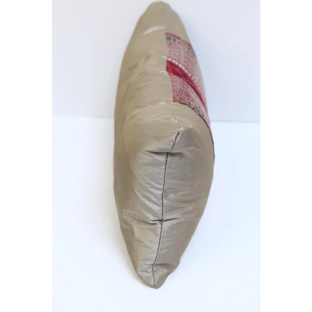 Custom pillows with vintage sari pieces framed with velvet trim. Pillow is made out of silk taffeta. Down filled. Price...