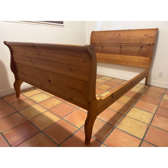 A solid pine hacienda-style queen bed frame crafted in the Mexican and Spanish Colonial tradition, featuring plank...