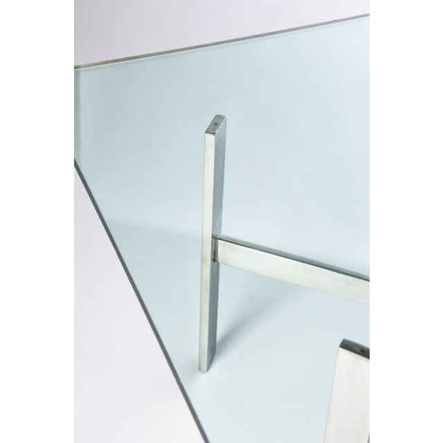 Rectangular 1970's polished steel base coffee table with new glass top.