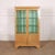 Small English 19th century pretty bleached walnut two door bookcase. Nice small size. 1880. This piece is designed in the...