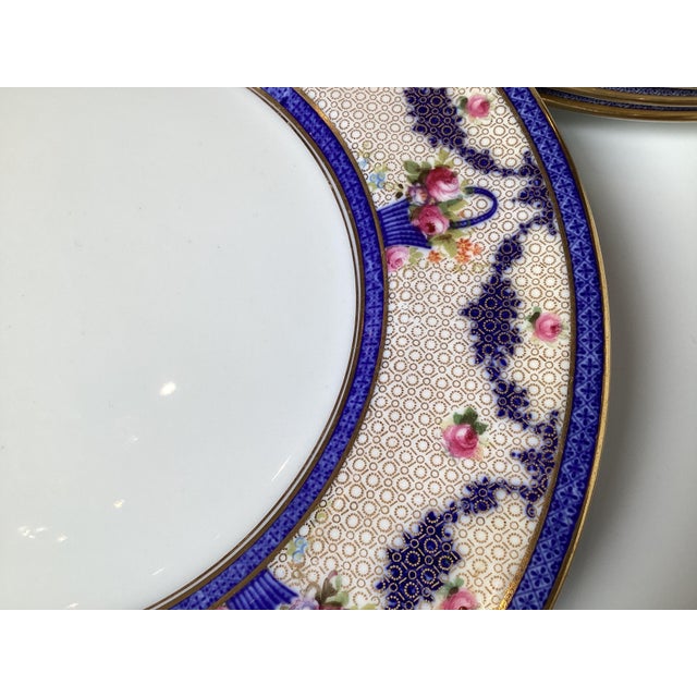 This set of twelve dinner plates are Royal Doulton, a renowned English ceramic and home accessories manufacturer. The mark...