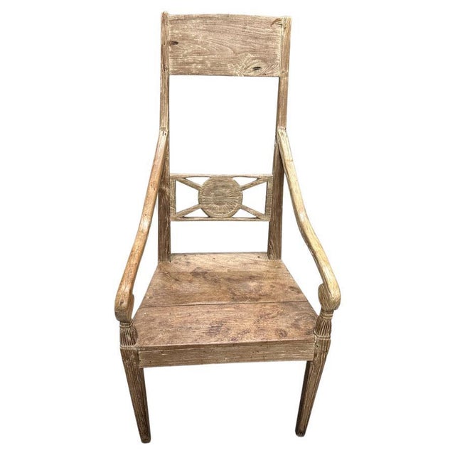 Beautiful patina and details on the arms and legs of this hand carved teak chair. Circa 1950. Full dimensions; 21" wide at...