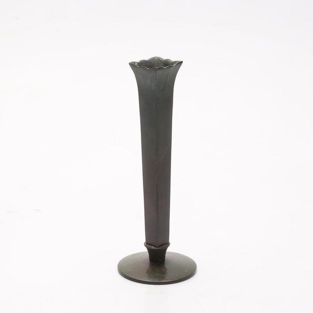 A refined and elegant bronze vase crafted by guldsmedsaktiebolaget (gab), sweden, circa 1930s. This tall, fluted vessel...